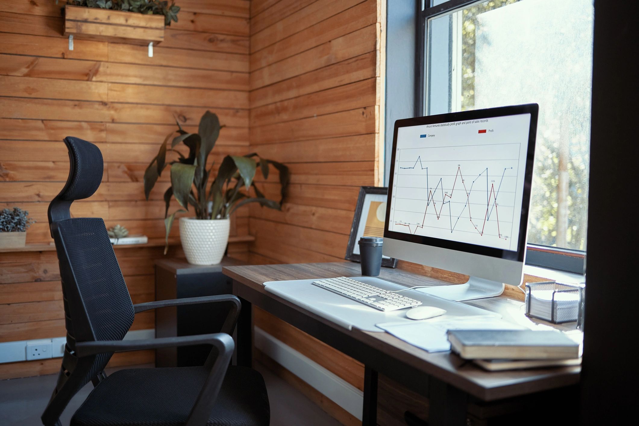 Modern workspace with digital screens representing energy comparison research