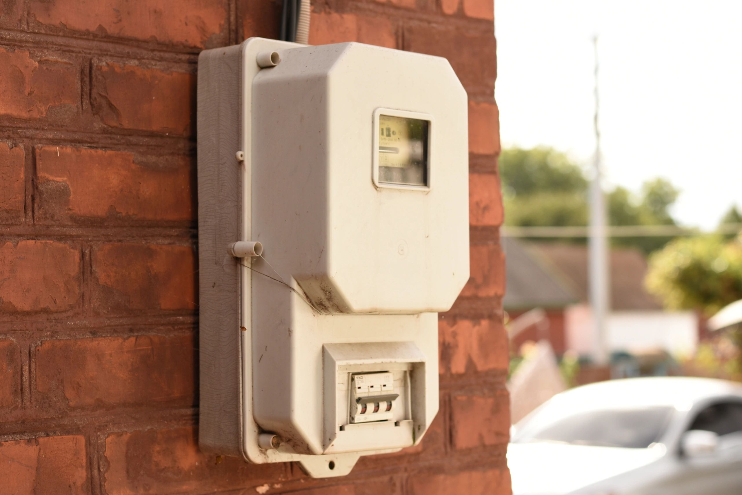 Residential electricity meter on a brick home in Texas