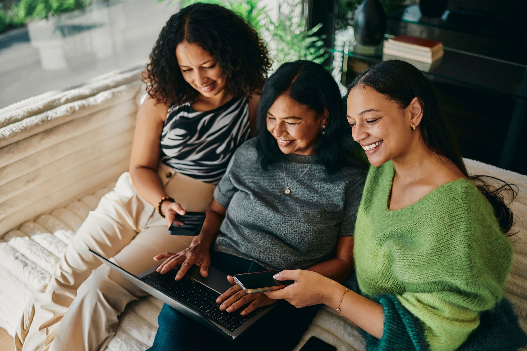 People reviewing information together on a laptop